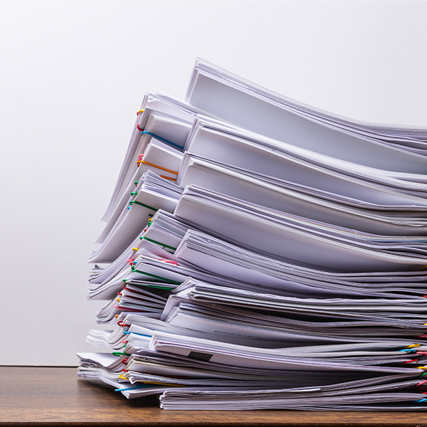 Stacks of sustainability reports representing a rapidly evolving ESG landscape.